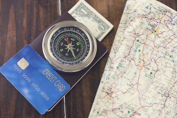 compass, passport, credit card, banknote, map for use as trip va