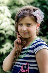 Naklejka premium Cute little girl summer portrait.
