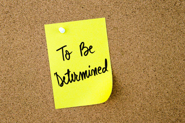 To Be Determined written on yellow paper note