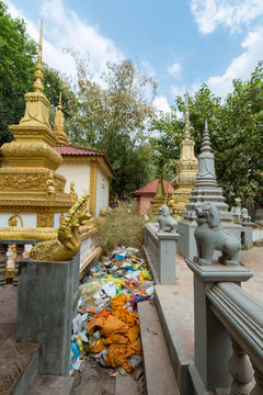 Traditional Khmer stupas in Siem Reap temple with rubbish, Cambo
