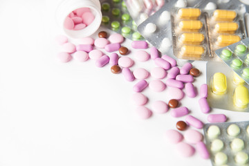 Colorful tablets on white background