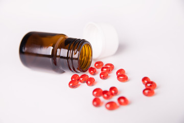 Pills scattered on white background