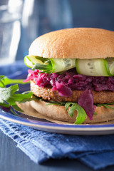 veggie soy burger with pickled red cabbage cucumber arugula