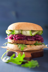 veggie soy burger with pickled red cabbage cucumber arugula