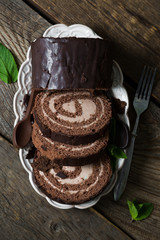 Chocolate roulade with mint leaves
