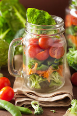 healthy vegetable salad in mason jar. tomato, broccoli, carrot,