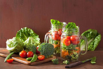 healthy vegetable salad in mason jar. tomato, broccoli, carrot,