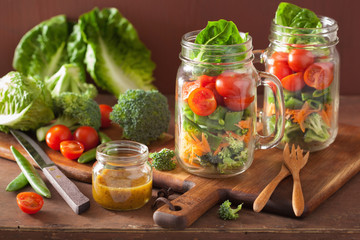 healthy vegetable salad in mason jar. tomato, broccoli, carrot,