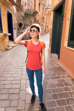Girl walking in old town in Greece