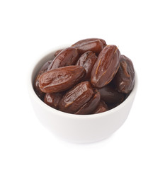Date fruits in bowl over isolated white background surface