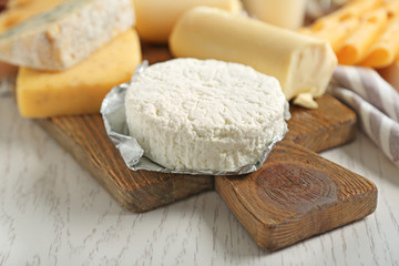 Set of fresh dairy products on white wooden table