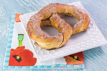 Fresh baked soft cinnamon flavored pretzel.