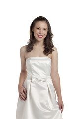 smiling teenage girl wearing white dress