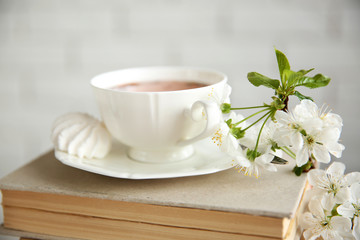 Obraz na płótnie Canvas Cup of tea and books, close up
