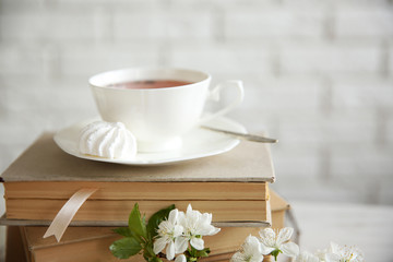 Cup of tea and books, close up