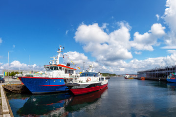 Two boats moored at the quay at the port of Stavanger, Norway.