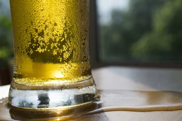 Foto op Plexiglas intoxicating beer in a glass   © volhanalhachova