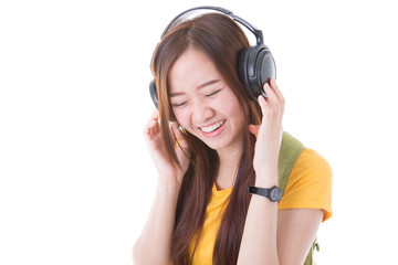 Fototapeta premium happy teen girl listening to music, full length, isolated on whi
