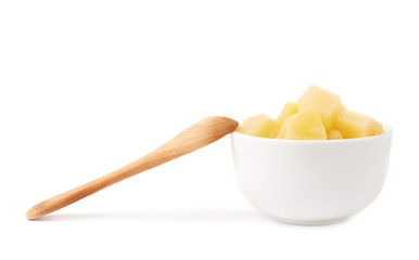 Pile of canned pineapple over isolated white background