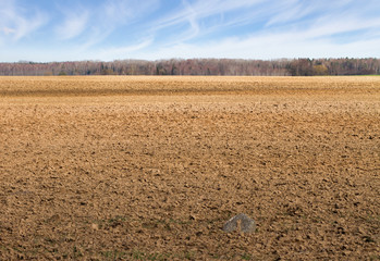 Landscape with plowed field.