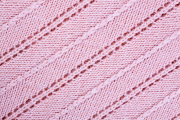 Pink knitted patterned fabric background