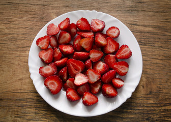halves of strawberries on a white plate