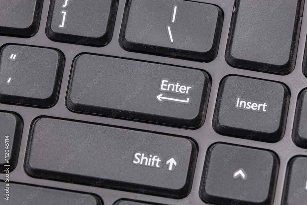 Fototapete black computer keyboard closeup on enter