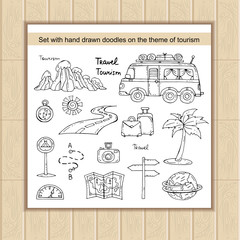 Vector set with hand drawn isolated doodles of tourism symbols.