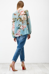 Naklejka premium Young woman in jeans clothes