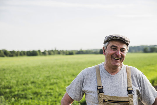 Portrait of smiling farmer at a field