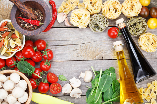 Fresh ingredients for cooking: pasta, tomato and spices