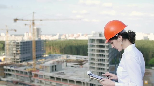Woman architect inspects the construction site