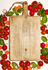 Fresh organic ingredients on white background Lots of copy space. Vegetarian food, health or cooking concept.