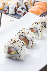 Salmon and caviar rolls served on a plate