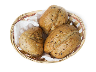 Oatmeal bun in a small basket on a white background