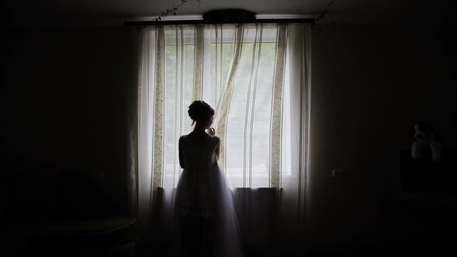 Silhouette of woman at the window