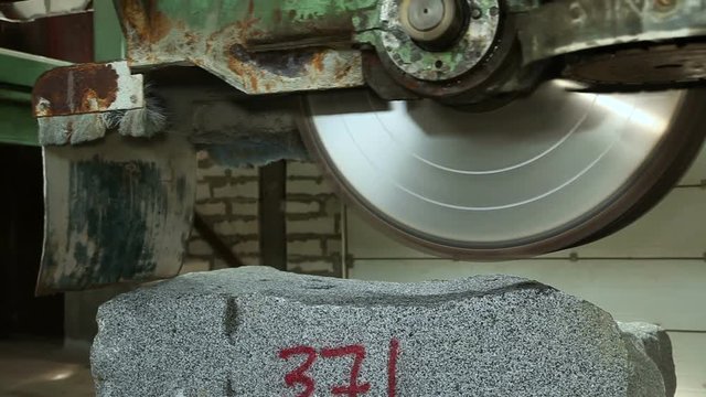 The machine with a circular saw for cutting granite stone