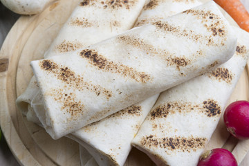 tortilla wraps with meat and vegetables