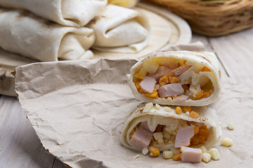 Breakfast burrito with eggs, cheddar, microgreens and roasted mu