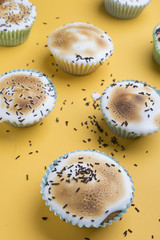 Cupcakes decorated with sprinkles and frosting