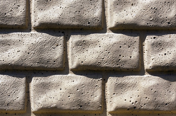 Beige brick stylized wall texture.