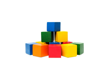 Wooden colorful building blocks isolated on white background. Cubes constructor. Vintage childrens toys.