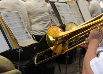 musician plays the trumpet in the orchestra
