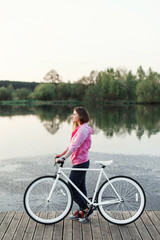 Fototapeta premium Hipster girl with modern bike