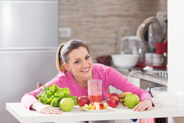 Healthy young woman enjoying in healthy food.