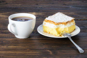 Tea and a peace of vanilla cream cake