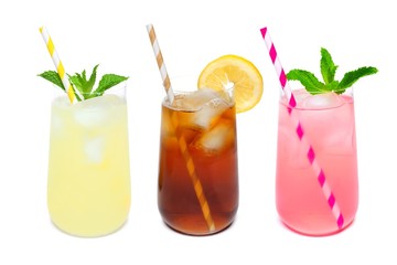 Three rounded glasses of summer lemonade, iced tea, and pink lemonade drinks with straws isolated on a white background
