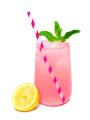 Glass of summer pink lemonade with mint and straw isolated on a white background