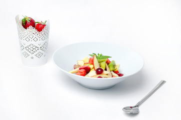 Fruit salad on a white background with berry