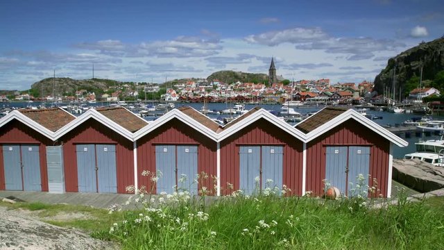 Fishing village Fjallbacka on the Swedish west coast (district Bohuslan). During the summer Fjallbacka is a vibrant tourist spot. Panning shot.